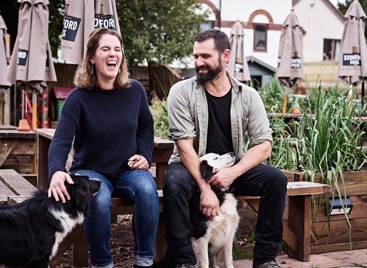 dog by owner in pub garden