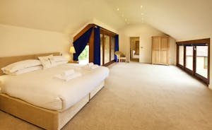 Coat Barn - On the first floor, Bedroom 1 is spacious, light and airy and has an en suite bathroom