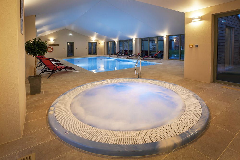 Indoor swimming pool with hot tub and sauna