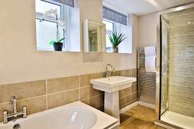 Spacious bathroom with shower, bath and basin on ground floor adjacent to the snug for easy access for the less mobile. www.bhhl.co.uk   The Anchor at Lydbrook Gloucestershire