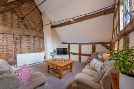 Luntley Court: Tucked away at one end of the house is a very cosy TV room/snug