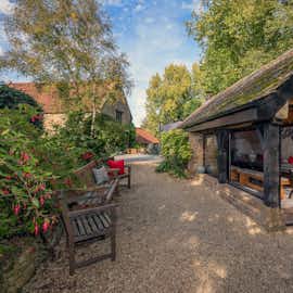 Kingshay Barton - Out in the garden there's a heated weatherproof BBQ bothy Kingshay Barton - Out in the garden there's a heated weatherproof BBQ bothy
