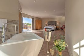 Inwood Farmhouse - Bedroom 5 (Sky Lane) has a free standing bath