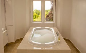 The Old Rectory - The bath in the en suite to the Hellier suite; imagine a bath full of bubbles - and that gorgeous view!