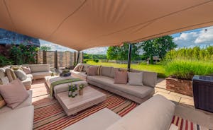 Ridgeview: Relax beneath the covered terrace, with festoon lighting for the evening