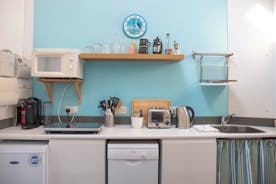 Kitchenette with new slimline dishwasher and fridge
