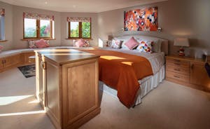 Hamble House - Bedroom 3 is a suite with a superking bed, comfy seating area, en suite bathroom and private balcony