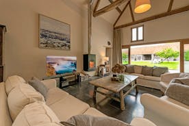 Court Farm : On colder days cosy up by the wood-burner in The Harvest Hall