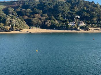 Lovely view of a beach in East Portlemouth near many detached houses