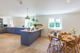 The Plough - The table at the end of the kitchen is a great spot for breakfasts or for when younger children need to eat earlier than the rest of you