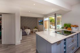 Dawdledown - The annexe has an open plan living space opening onto a courtyard garden with a hot tub