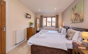 Thorncombe - Bedroom 2 is on the ground floor with an en suite bathroom with a lovely roll top bath