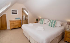Foxcombe - Light and spacious, Bedroom 6 is on the first floor; have the beds as twins or a superking. There's a generously sized an en suite shower room