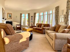 The Cottage Beyond: The sitting room - big windows, gorgeous curved walls