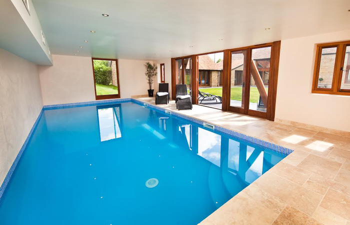 large barn conversion perfect for family holidays and celebrations. Sleeps 18 in 8 en suite rooms with indoor pool and games room