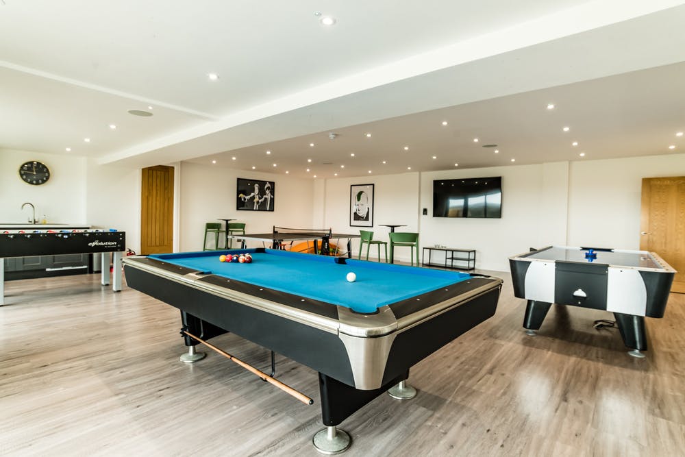 Churchill games room equipped with pool table table tennis table football and air hockey