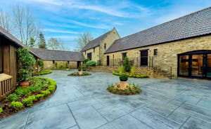 Kingshay Barton - At the front of the house there's a paved courtyard and steps to the main entrance to the house