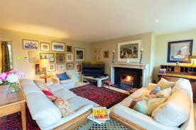 House On The Hill - The more intimate Sitting Room; homely furnishings, and the warmth of an open fire