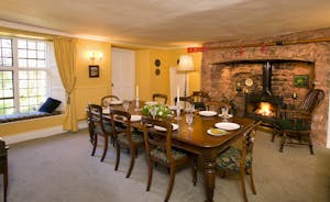 Cobbleside - The elegant dining room with feature inglenook fireplace is perfect for happy celebrations