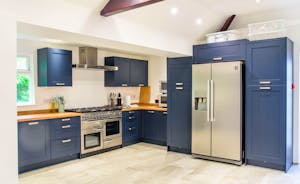 The stunning blue kitchen in Forest House, an 11 bed holiday house at Coleford - www.bhhl.co.uk
