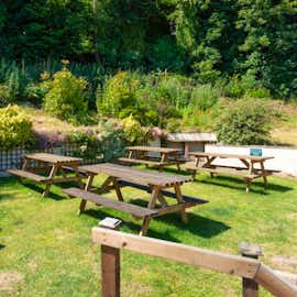 Relax in the sunny garden and Hot Tub River Wye Lodge sleeping 26 with 12 bedrooms holiday accommodation Nr. Forest of Dean Gloucestershire www.bhhl.co.uk Relax in the sunny garden and Hot Tub River Wye Lodge sleeping 26 with 12 bedrooms holiday accommodation Nr. Forest of Dean Gloucestershire www.bhhl.co.uk