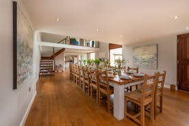 Coat Barn - A long and light and airy dining hall, with room for all