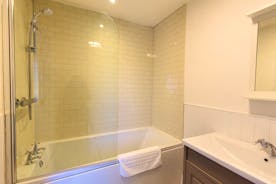 The Plough - The en suite for Bedroom 1 has a bath with an overhead shower