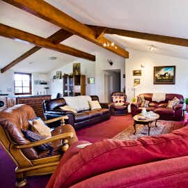 Large  lounge with doors leading to the outside High Cloud Farm Family and friends accommodation Monmouthshire www.bhhl.co.uk Large  lounge with doors leading to the outside High Cloud Farm Family and friends accommodation Monmouthshire www.bhhl.co.uk