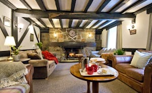 Traditional Sitting Room at The Anchor with beamed ceiling and feature fireplace for large groups www.bhhl.co.uk