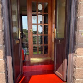 Tiled front porch at HH which has upvc windows and doors. Tiled front porch at HH which has upvc windows and doors.
