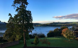 Hurstone: Mist rising from the river valley at the front of the house