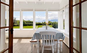Sunroom/Dining Room - overlooking the garden and with wonderful views this is a lovely room to enjoy meals at any time of the day or night