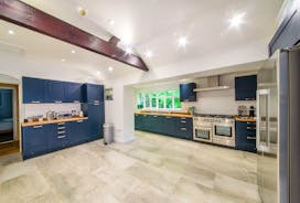 The large kitchen with feature beam at Forest House holiday house in the Wye Valley - www.bhhl.co.uk