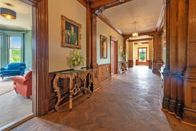 Wonham House - The wide hall has original parquet flooring and wood panelling