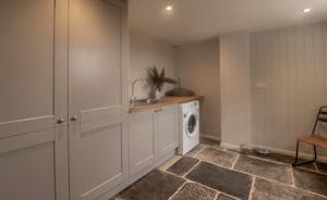 Withymans - The  spacious utility room has an extra fridge-freezer as well as laundry facilities